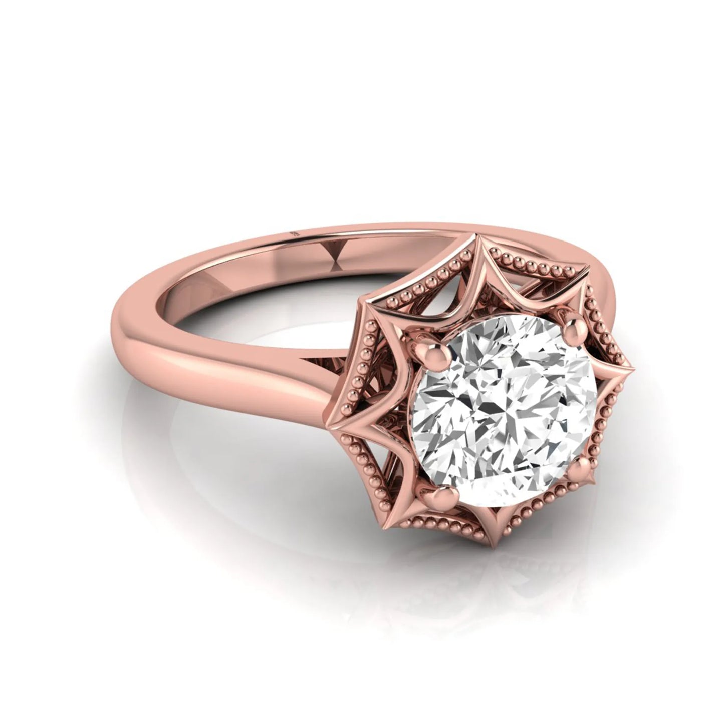 Round prong set lab grown diamond vintage solitaire engagement ring featuring a 1.28 carat round center diamond in an intricate starburst setting with milgrain detailing in rose gold