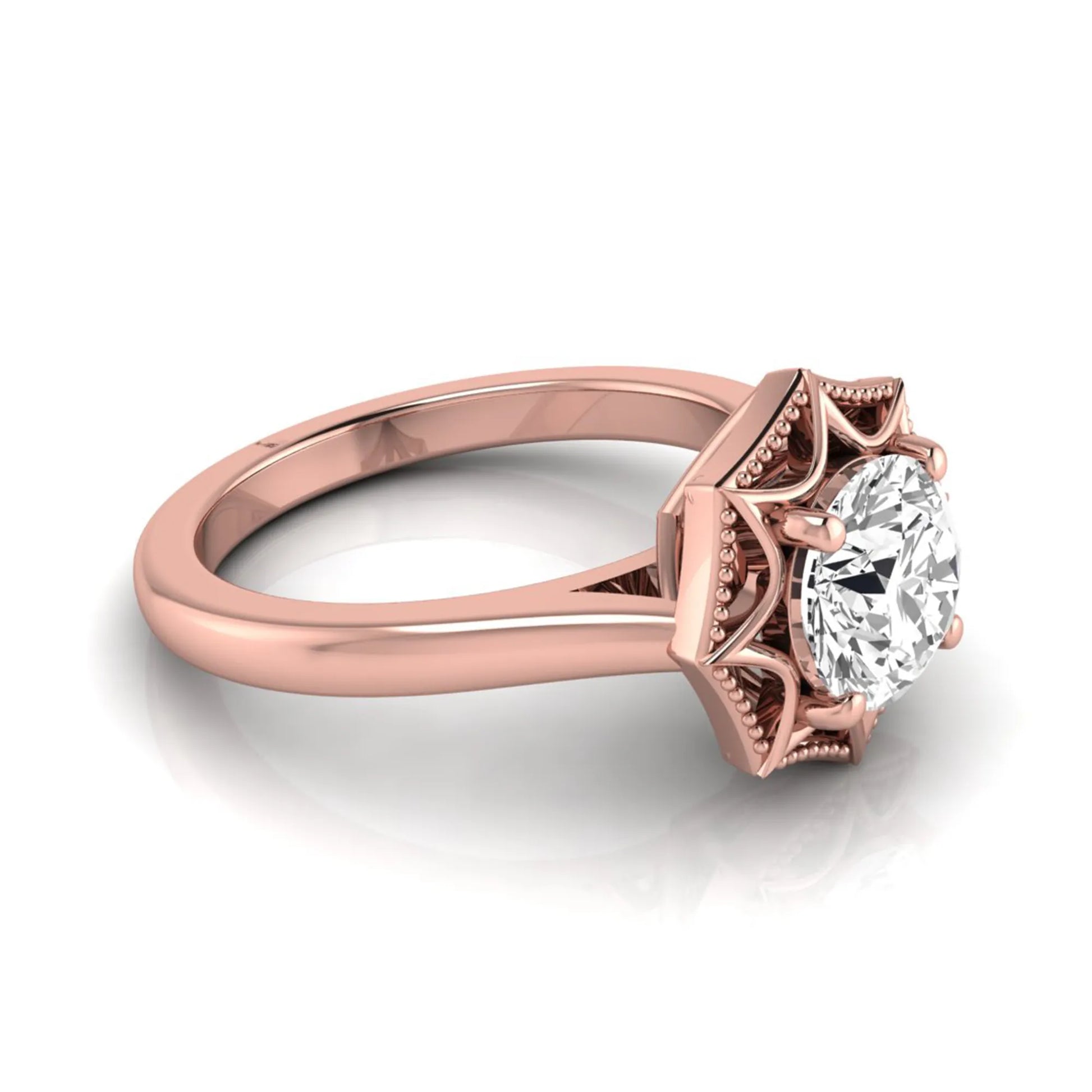 Round prong set lab grown diamond vintage solitaire engagement ring featuring a 1.28 carat round center diamond in an intricate starburst setting with milgrain detailing in rose gold