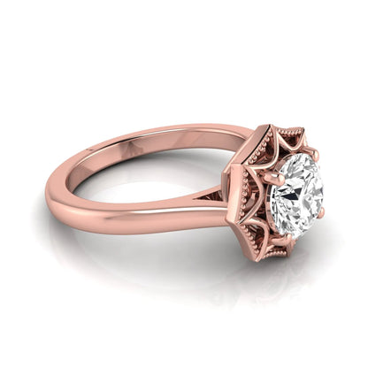Round prong set lab grown diamond vintage solitaire engagement ring featuring a 1.28 carat round center diamond in an intricate starburst setting with milgrain detailing in rose gold