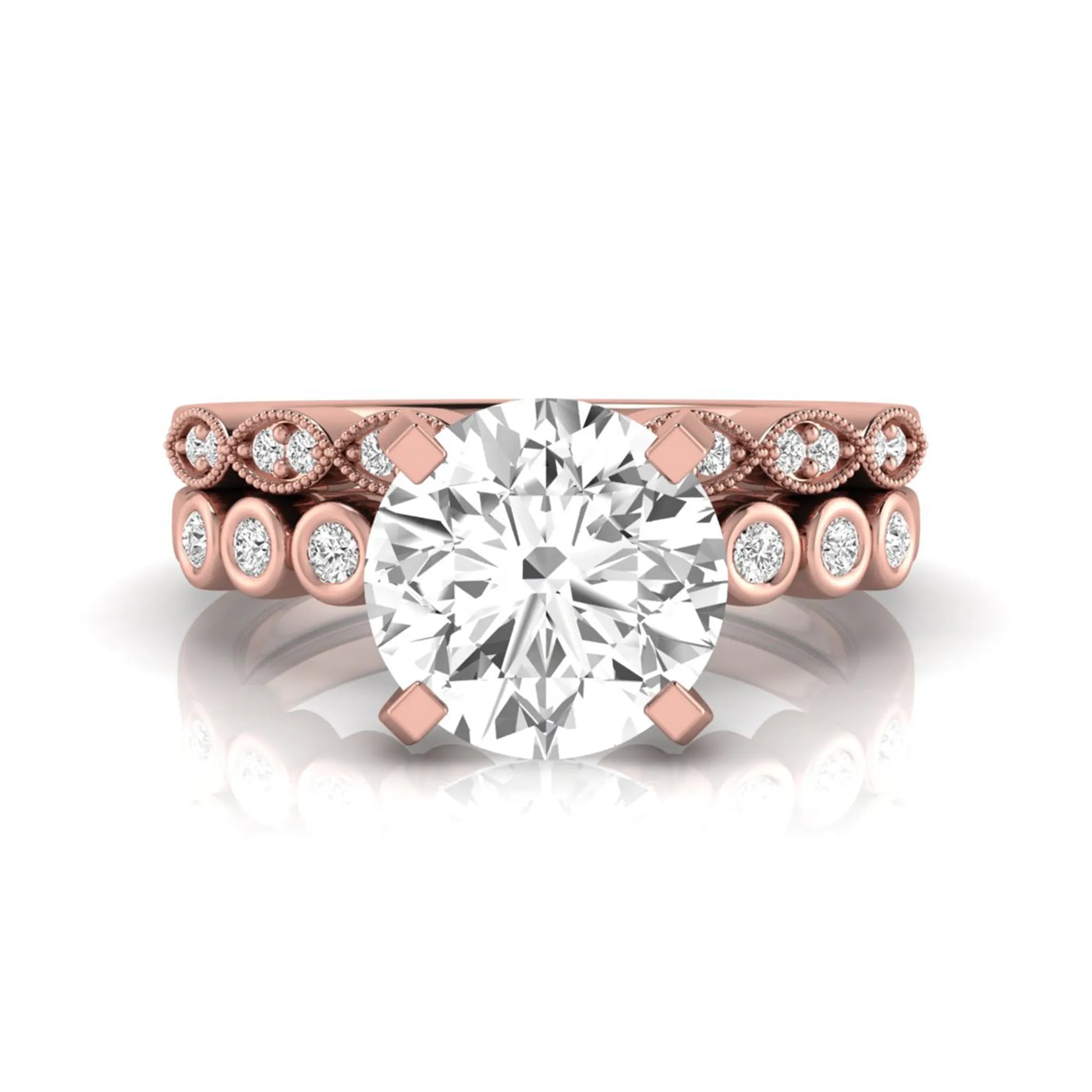 Round cut lab grown diamond bridal ring set featuring a four-prong solitaire engagement ring with a matching side stone wedding band accented by round bezel-set diamonds and vintage milgrain detailing in rose gold