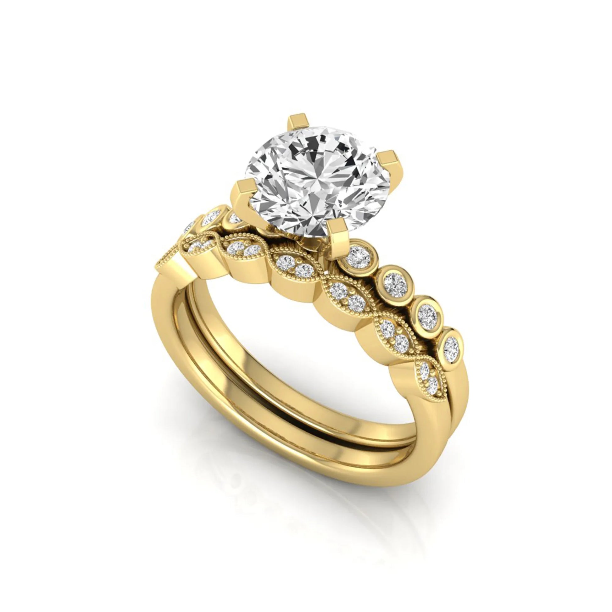 Round cut lab grown diamond bridal ring set featuring a four-prong solitaire engagement ring with a matching side stone wedding band accented by round bezel-set diamonds and vintage milgrain detailing in yellow gold