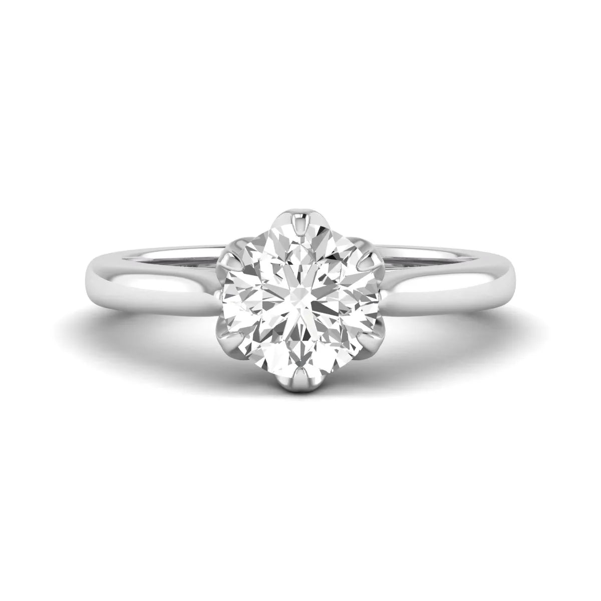 Round cut lab grown diamond solitaire engagement ring featuring a classic six-prong setting in white gold tone design.