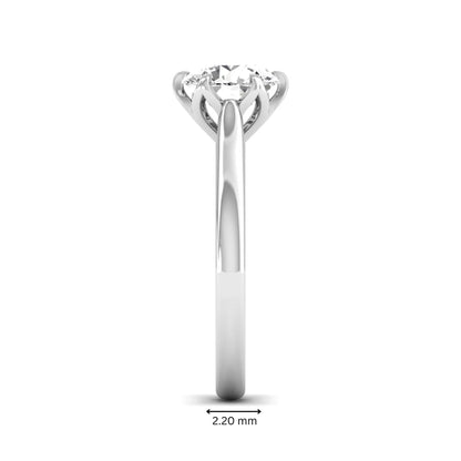Round cut lab grown diamond solitaire engagement ring featuring a classic six-prong setting in white gold tone design.