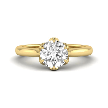 Round cut lab grown diamond solitaire engagement ring featuring a classic six-prong setting in yellow gold tone design.