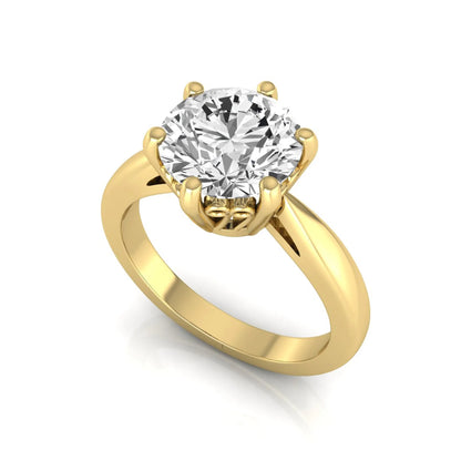 Round cut lab grown diamond solitaire engagement ring featuring a classic six-prong setting with a polished yellow gold finish band.