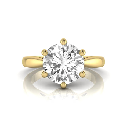 Round cut lab grown diamond solitaire engagement ring featuring a classic six-prong setting with a polished yellow gold finish band.