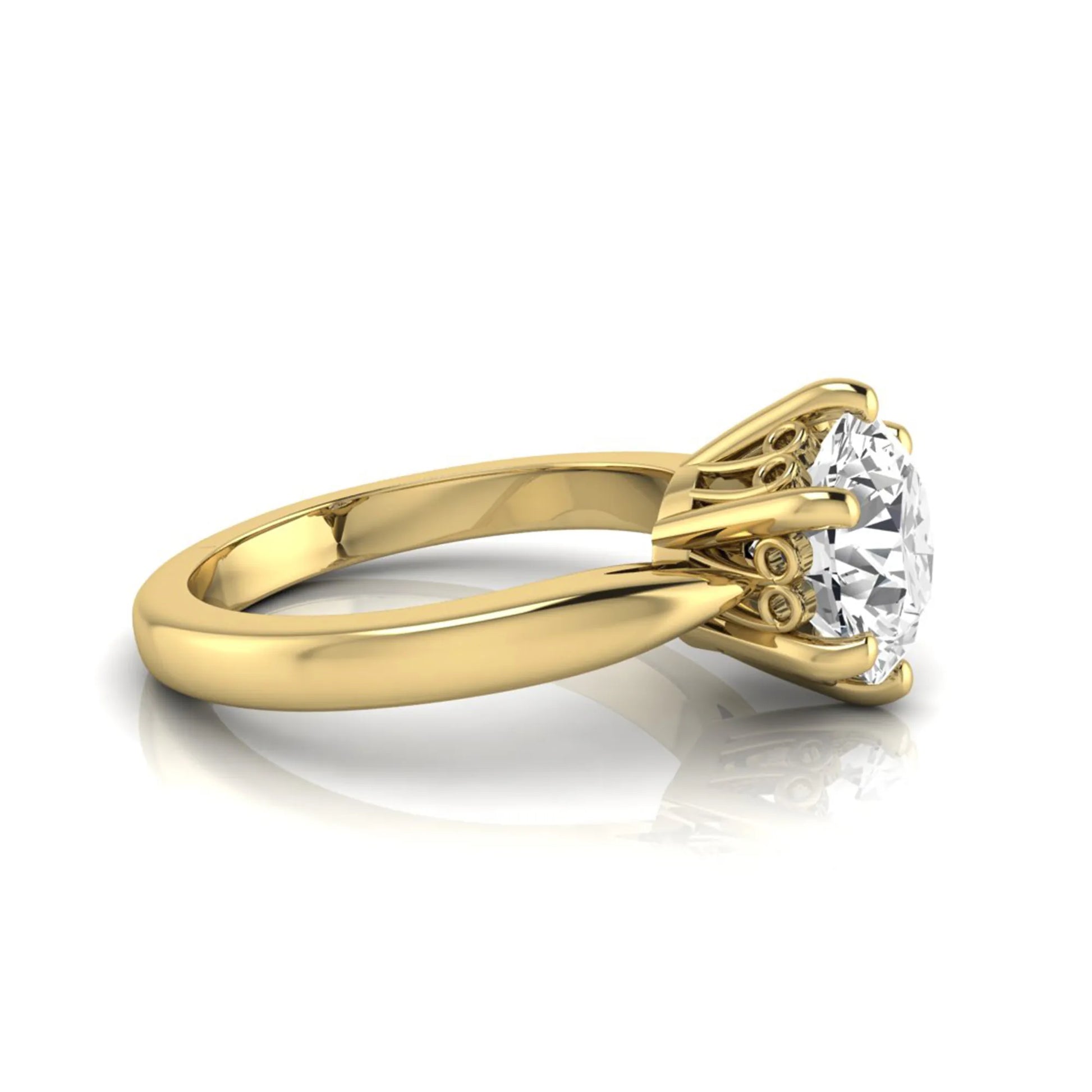 Round cut lab grown diamond solitaire engagement ring featuring a classic six-prong setting with a polished yellow gold finish band.