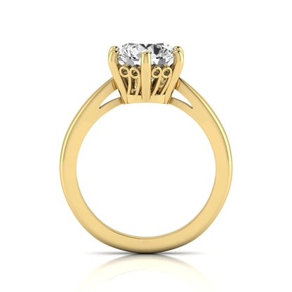 Round cut lab grown diamond solitaire engagement ring featuring a classic six-prong setting with a polished yellow gold finish band.
