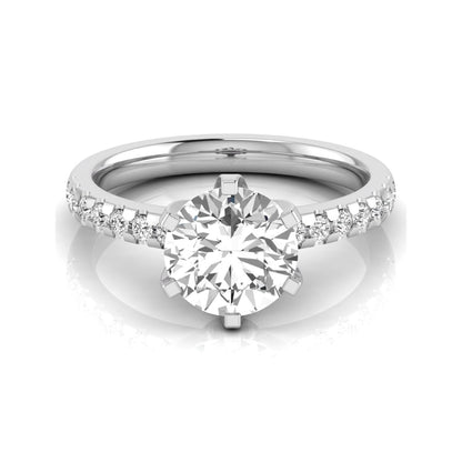 Round cut lab grown diamond solitaire engagement ring featuring a six-prong setting with a pavé diamond band in white gold tone.