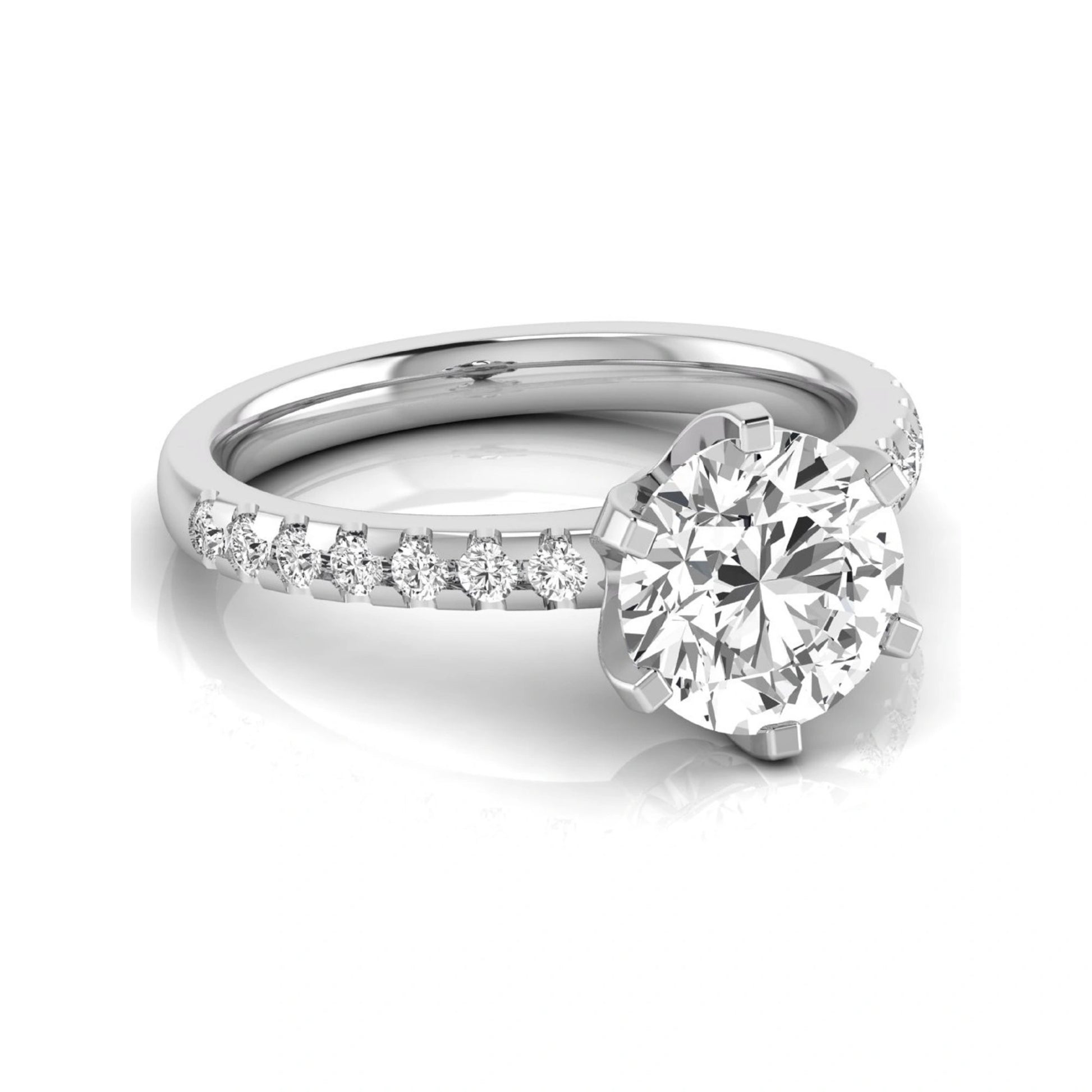 Round cut lab grown diamond solitaire engagement ring featuring a six-prong setting with a pavé diamond band in white gold tone.