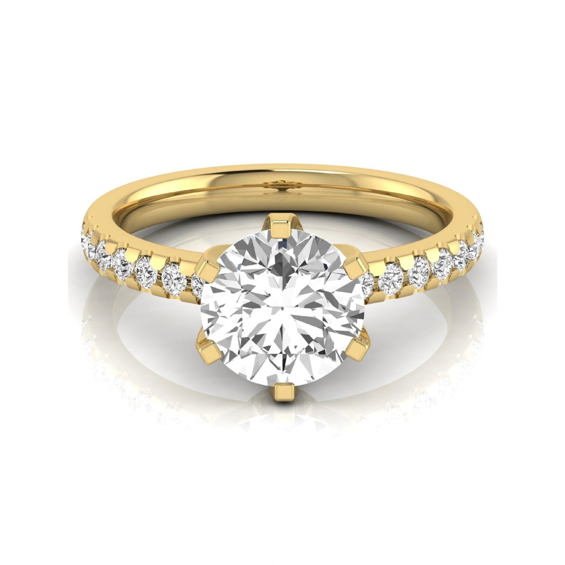 Round cut lab grown diamond solitaire engagement ring featuring a six-prong setting with a pavé diamond band in yellow gold tone.