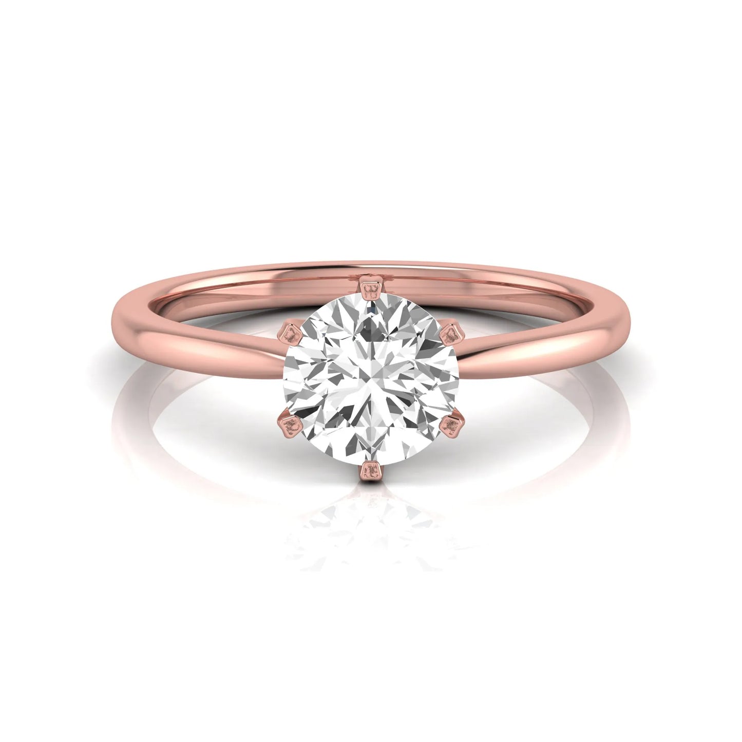 Round six prong set lab grown diamond solitaire engagement ring featuring a 1.28 carat round center diamond in a classic six-prong setting in rose gold