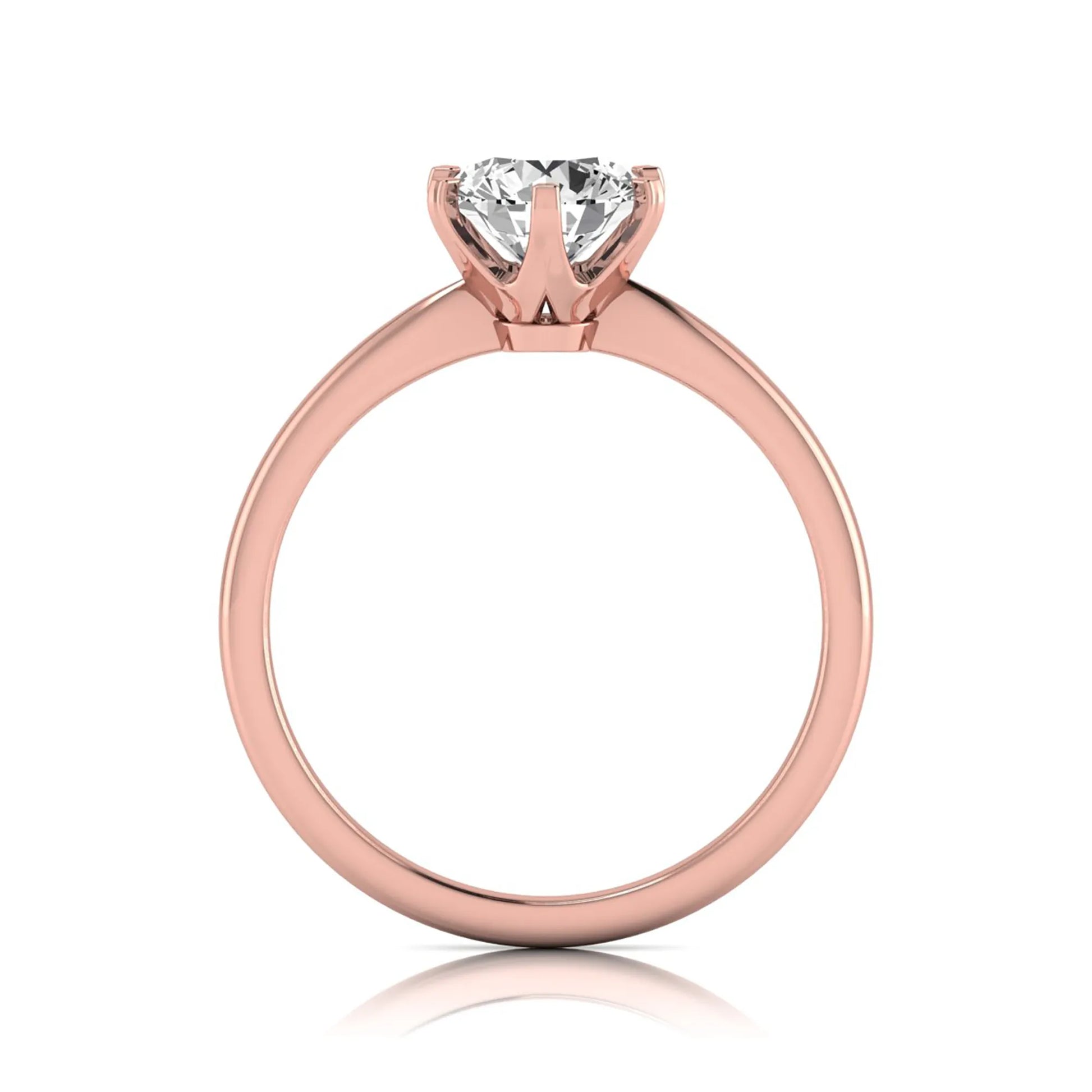 Round six prong set lab grown diamond solitaire engagement ring featuring a 1.28 carat round center diamond in a classic six-prong setting in rose gold