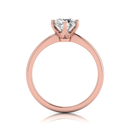 Round six prong set lab grown diamond solitaire engagement ring featuring a 1.28 carat round center diamond in a classic six-prong setting in rose gold
