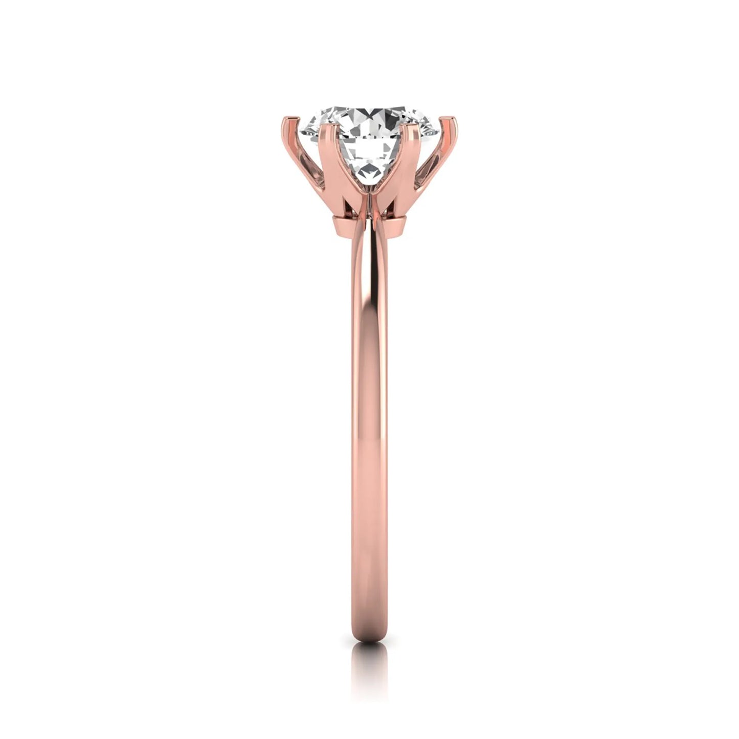 Round six prong set lab grown diamond solitaire engagement ring featuring a 1.28 carat round center diamond in a classic six-prong setting in rose gold