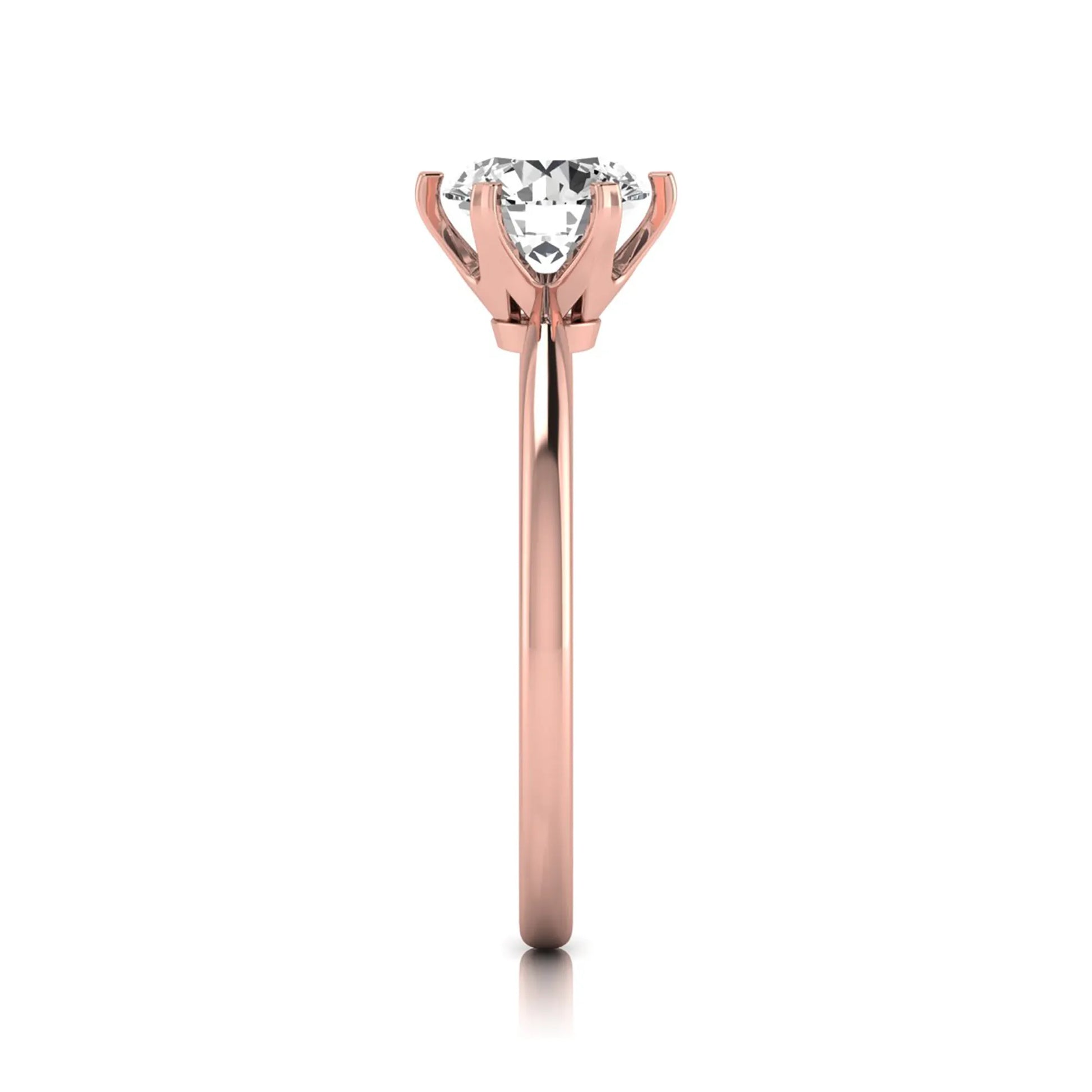 Round six prong set lab grown diamond solitaire engagement ring featuring a 1.28 carat round center diamond in a classic six-prong setting in rose gold