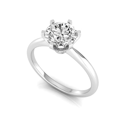 Round six prong set lab grown diamond solitaire engagement ring featuring a 1.28 carat round center diamond in a classic six-prong setting in white gold