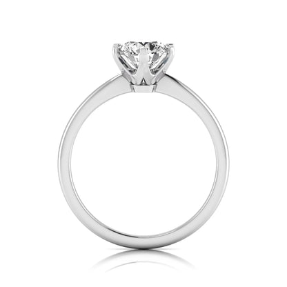 Round six prong set lab grown diamond solitaire engagement ring featuring a 1.28 carat round center diamond in a classic six-prong setting in white gold