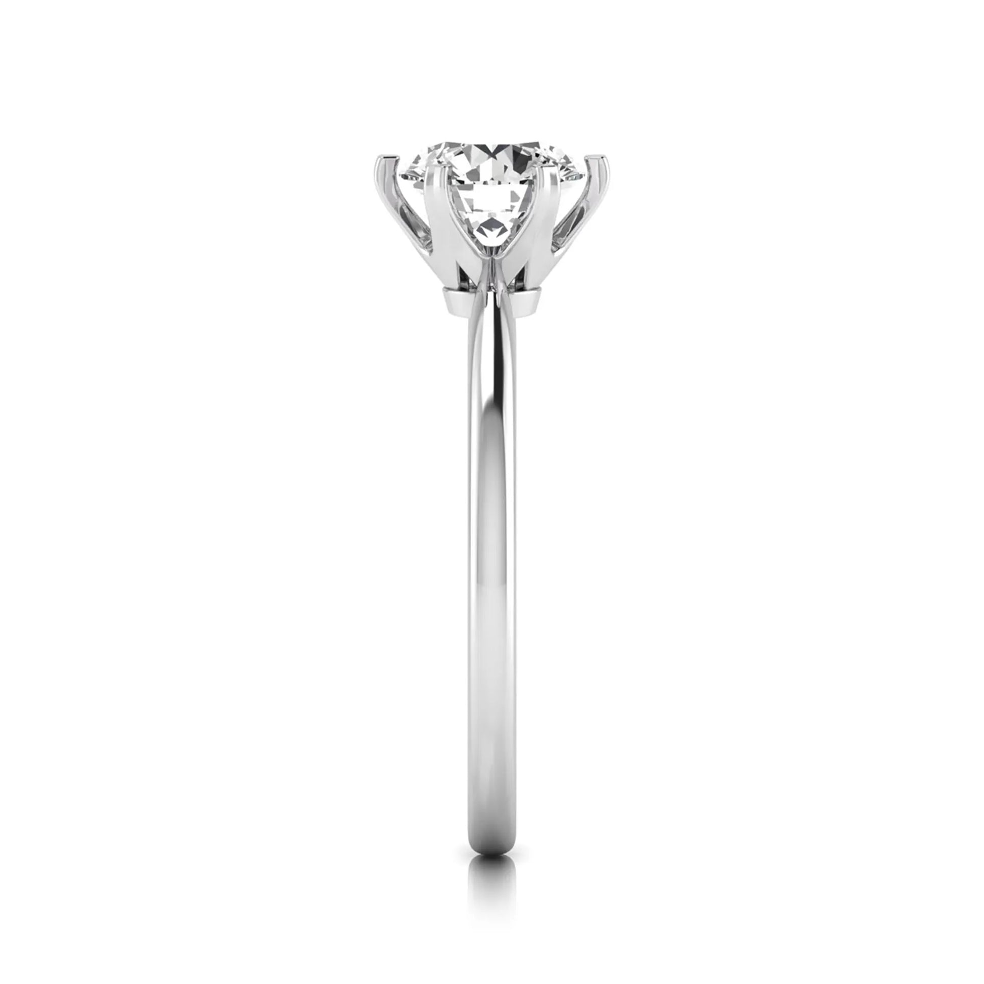 Round six prong set lab grown diamond solitaire engagement ring featuring a 1.28 carat round center diamond in a classic six-prong setting in white gold