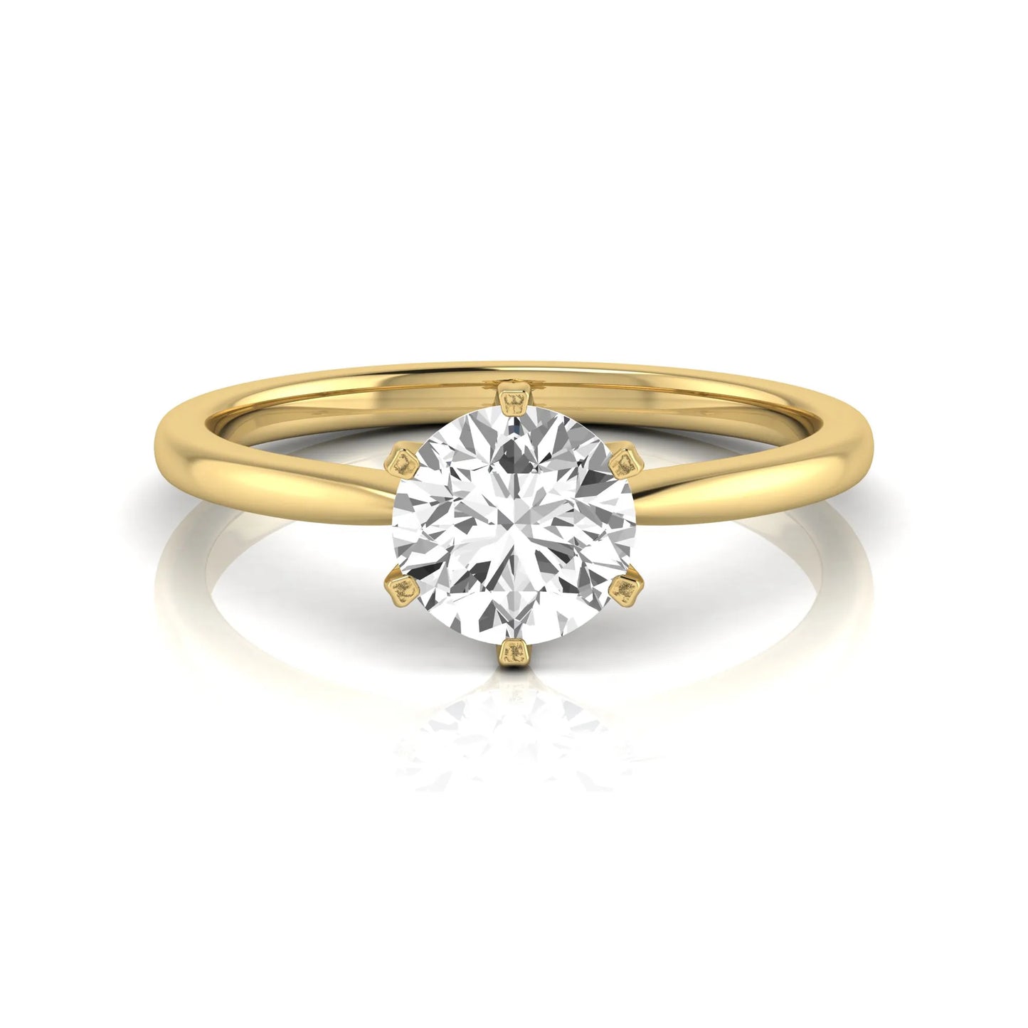 Round six prong set lab grown diamond solitaire engagement ring featuring a 1.28 carat round center diamond in a classic six-prong setting in yellow gold