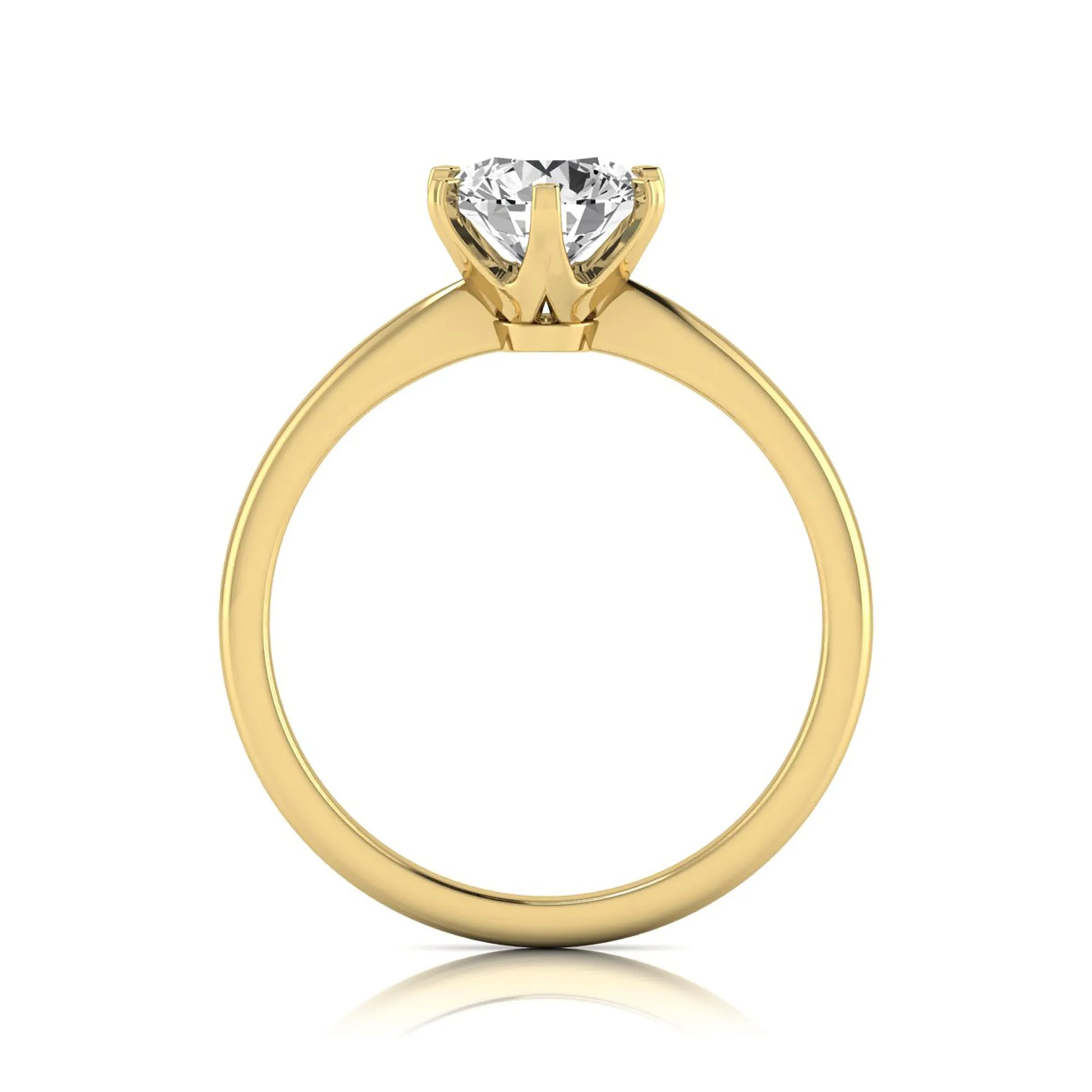 Round six prong set lab grown diamond solitaire engagement ring featuring a 1.28 carat round center diamond in a classic six-prong setting in yellow gold
