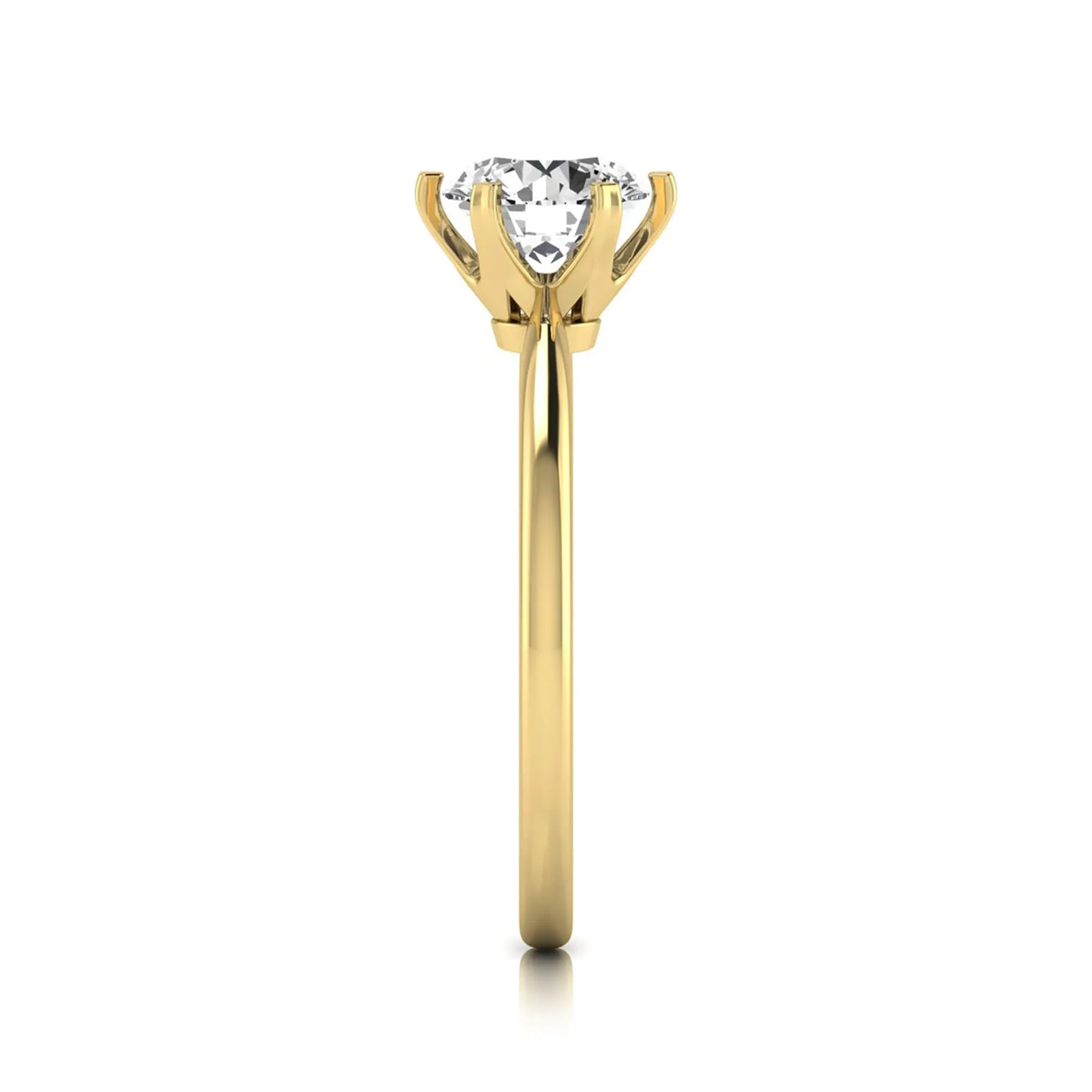 Round six prong set lab grown diamond solitaire engagement ring featuring a 1.28 carat round center diamond in a classic six-prong setting in yellow gold
