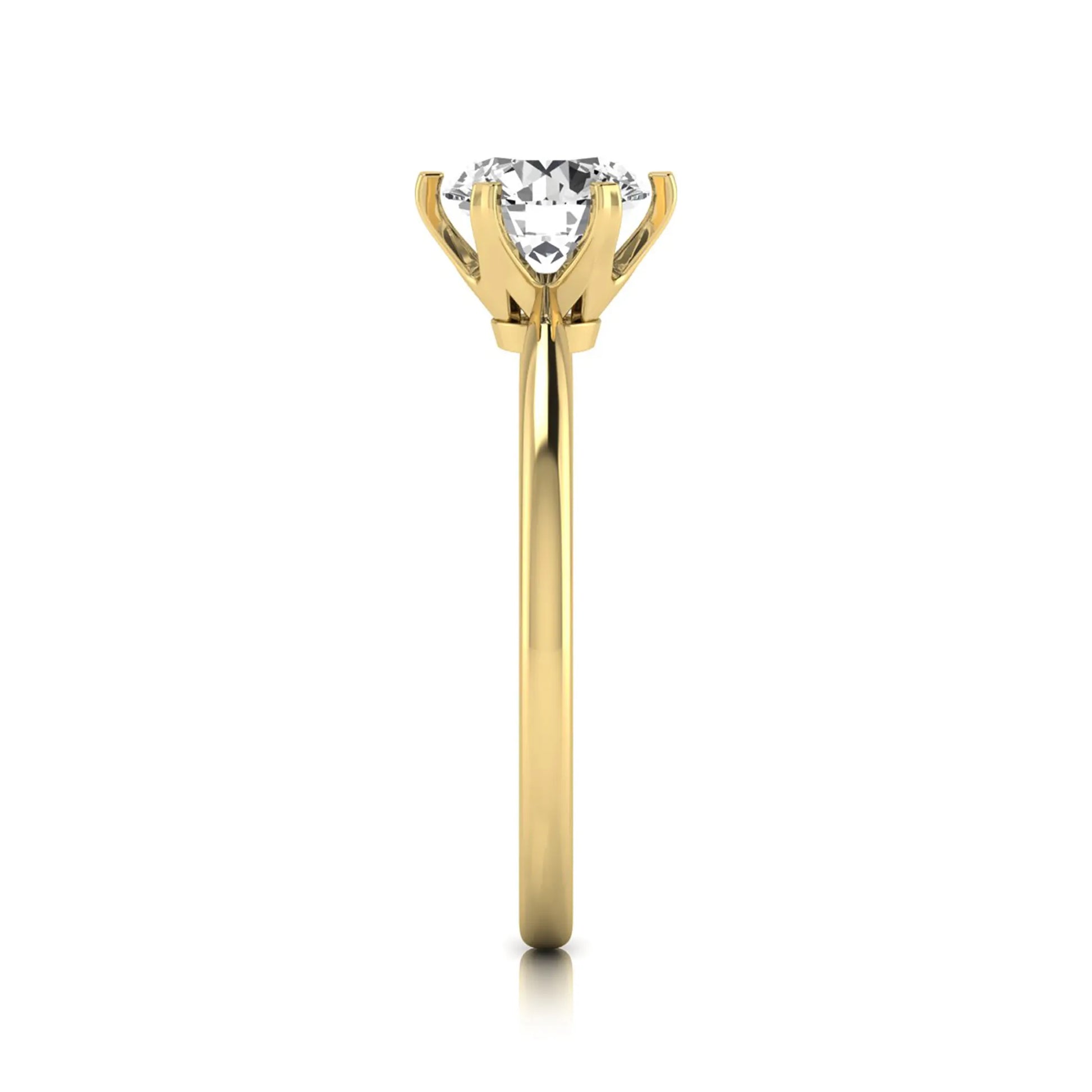 Round six prong set lab grown diamond solitaire engagement ring featuring a 1.28 carat round center diamond in a classic six-prong setting in yellow gold