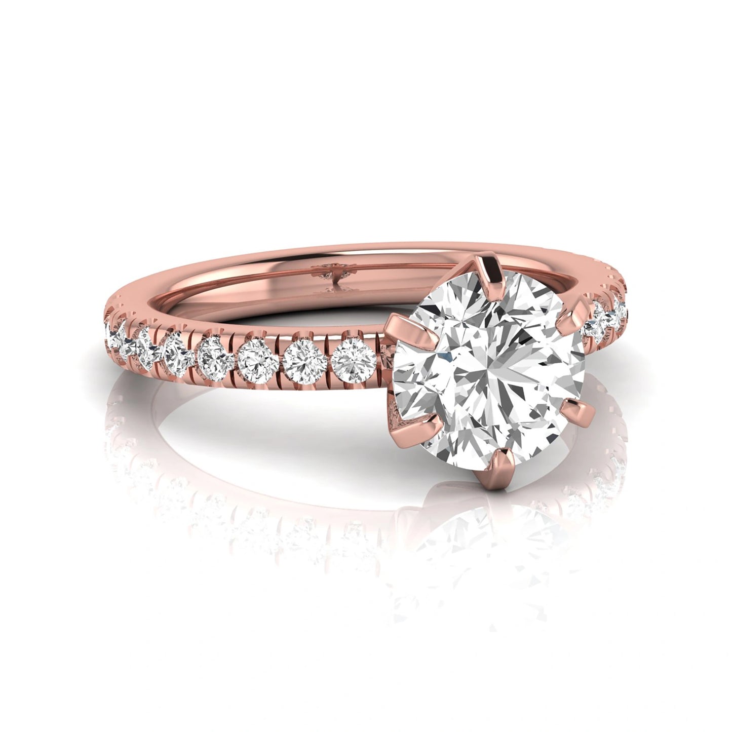 Round cut lab grown diamond engagement ring featuring a six-prong solitaire setting with a pavé accent band and polished rose gold tone finish.
