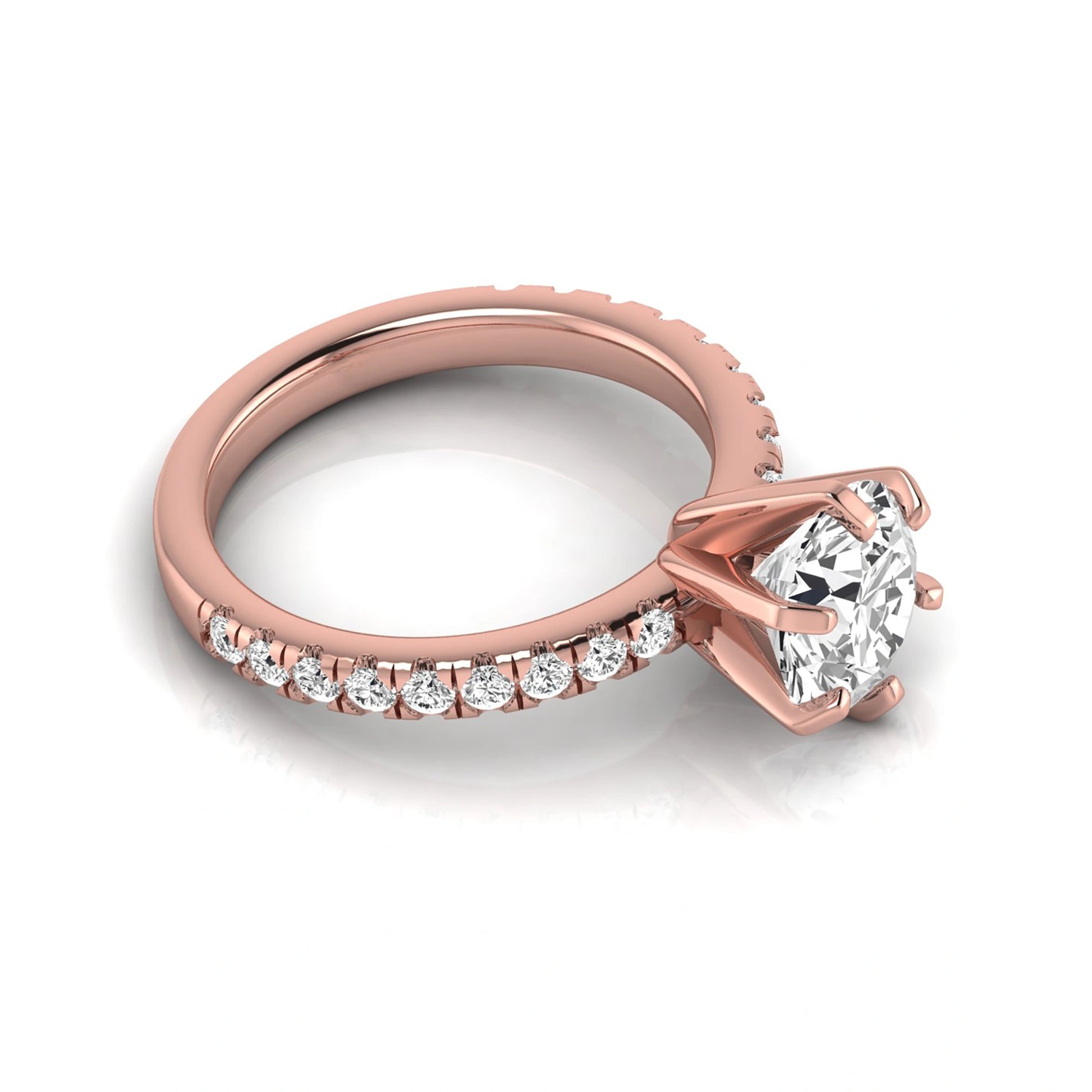Round cut lab grown diamond engagement ring featuring a six-prong solitaire setting with a pavé accent band and polished rose gold tone finish.
