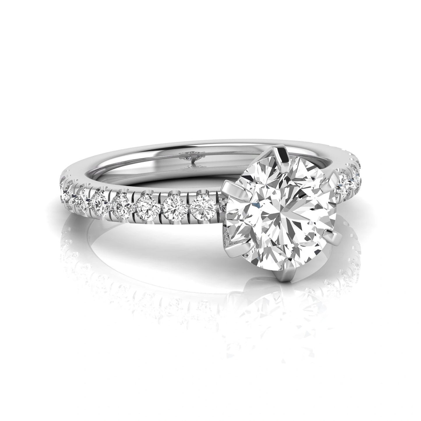 Round cut lab grown diamond engagement ring featuring a six-prong solitaire setting with a pavé accent band and polished white gold tone finish.