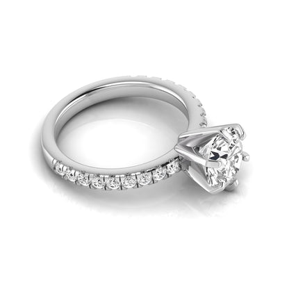 Round cut lab grown diamond engagement ring featuring a six-prong solitaire setting with a pavé accent band and polished white gold tone finish.
