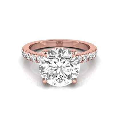 Round cut lab grown diamond engagement ring featuring a 3.87 carat IGI certified center diamond in a four-prong setting with round accent diamonds on a rose gold band.