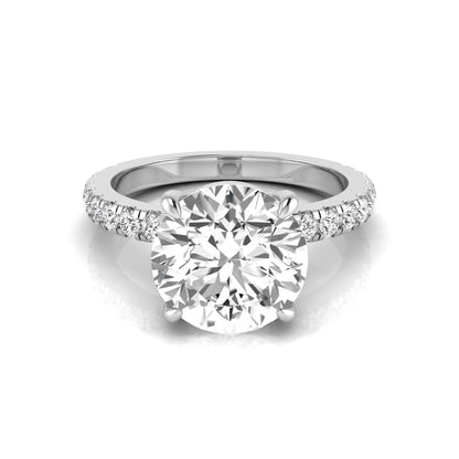 Round cut lab grown diamond engagement ring featuring a 3.87 carat IGI certified center diamond in a four-prong setting with round accent diamonds on a white gold band.