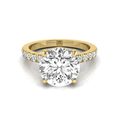 Round cut lab grown diamond engagement ring featuring a 3.87 carat IGI certified center diamond in a four-prong setting with round accent diamonds on a yellow gold band.