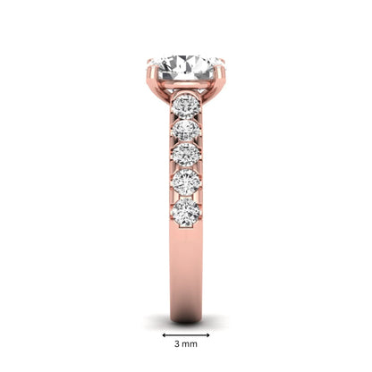Round solitaire accent lab grown diamond engagement ring featuring a 2.50 carat round brilliant IGI certified center diamond with round accent diamonds on a rose gold band.