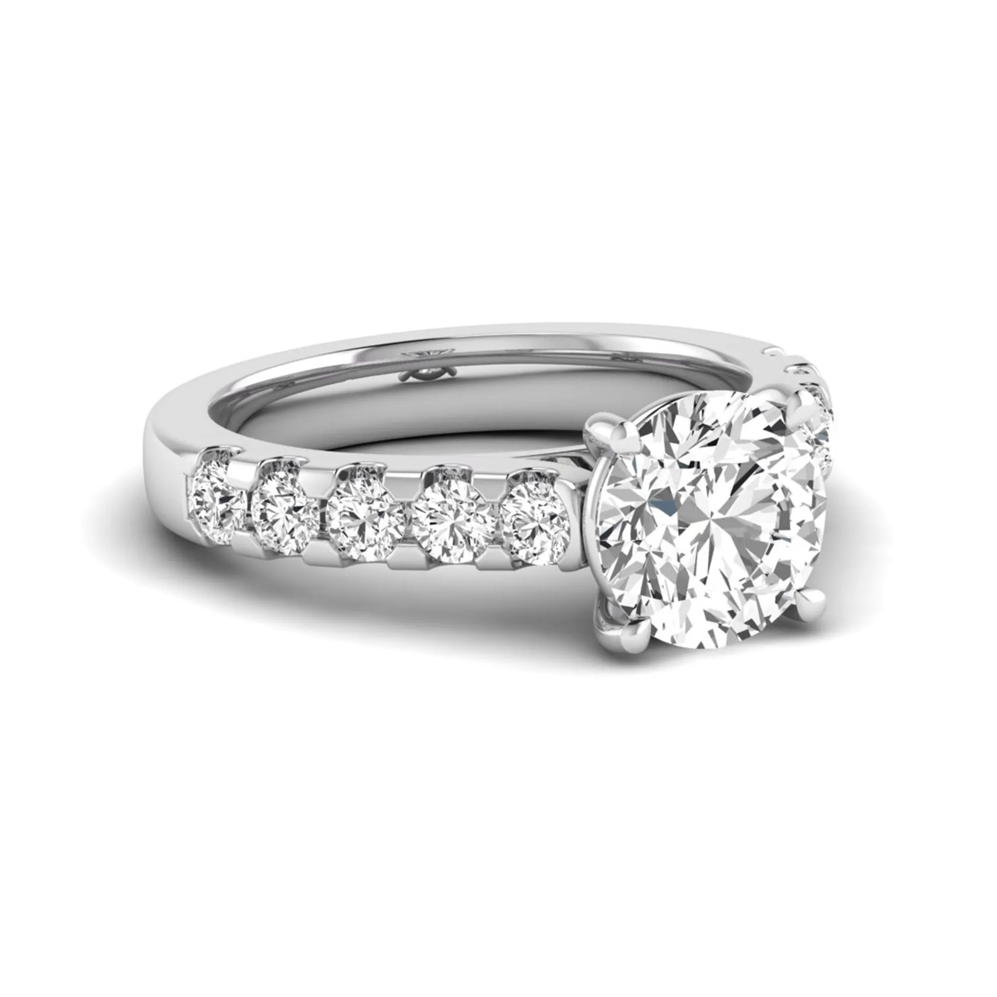 Round solitaire accent lab grown diamond engagement ring featuring a 2.50 carat round brilliant IGI certified center diamond with round accent diamonds on a white gold band.