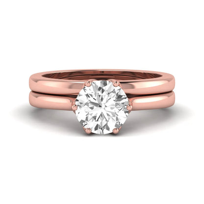 IGI Certified 1.67 carat round cut lab grown diamond solitaire bridal ring set with matching plain wedding band in rose gold.