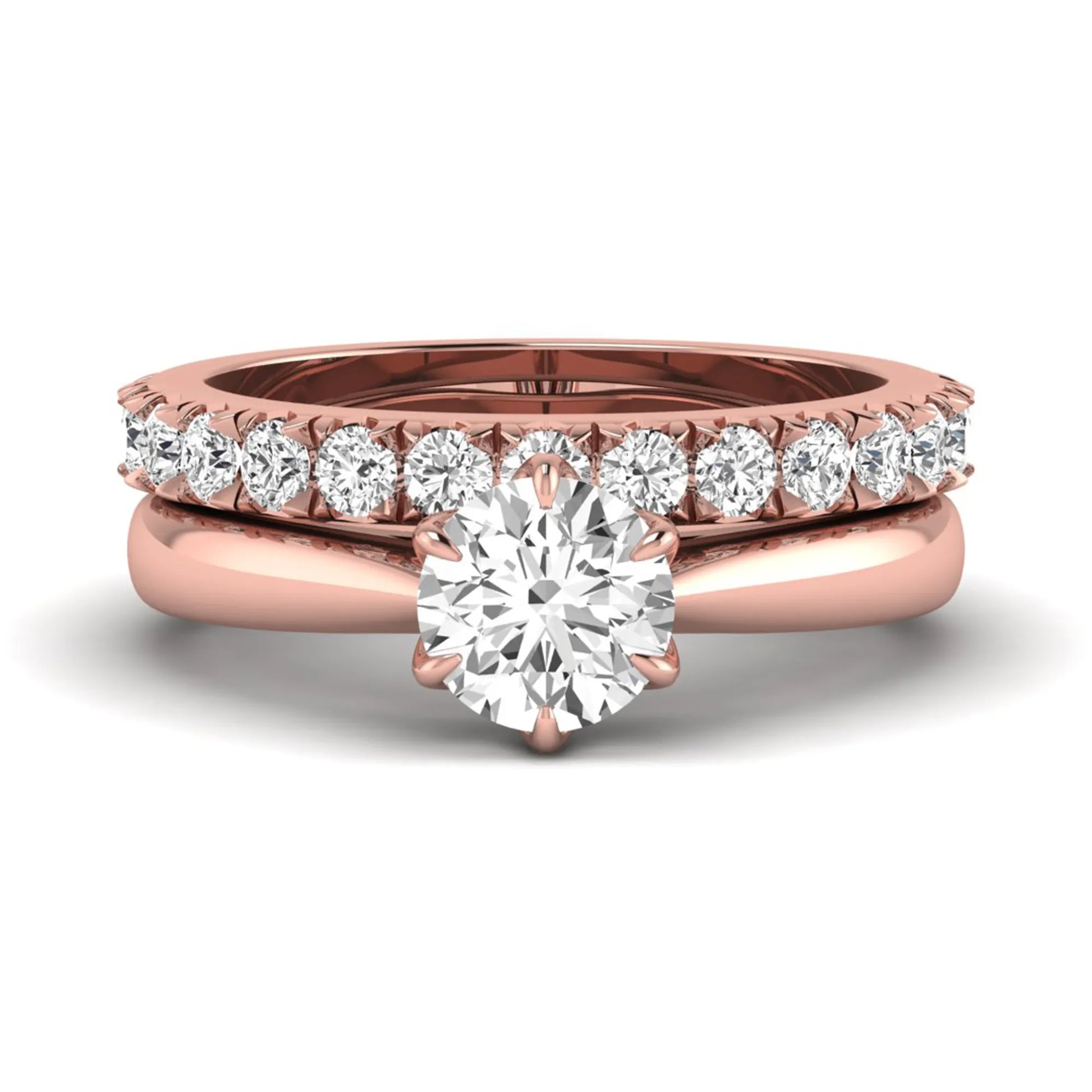 Round cut lab grown diamond solitaire bridal ring set featuring a six-prong engagement ring with a matching shared-prong round diamond wedding band in rose gold tone design.