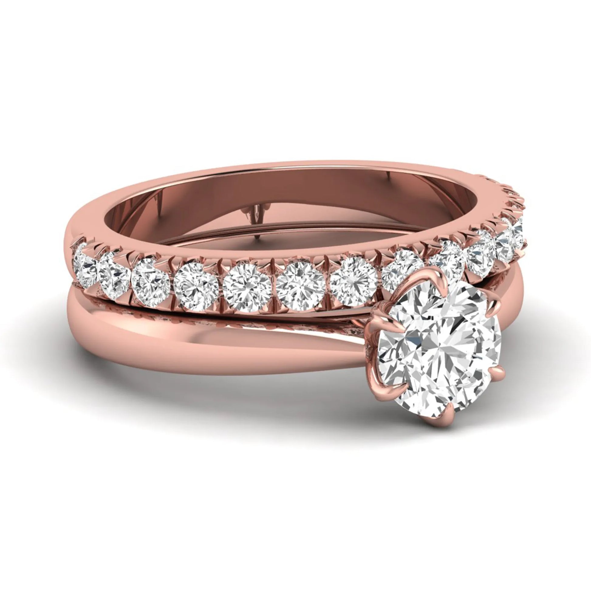 Round cut lab grown diamond solitaire bridal ring set featuring a six-prong engagement ring with a matching shared-prong round diamond wedding band in rose gold tone design.