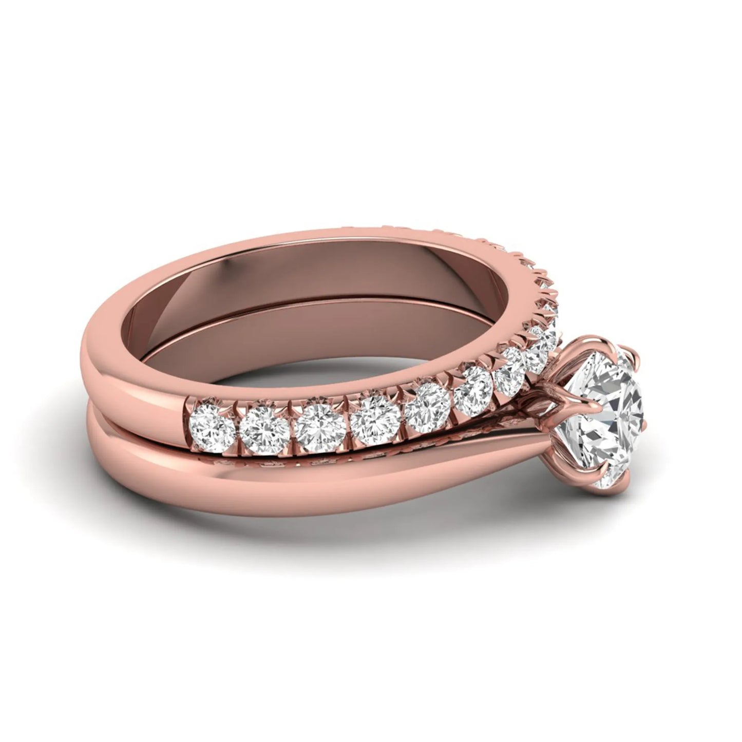 Round cut lab grown diamond solitaire bridal ring set featuring a six-prong engagement ring with a matching shared-prong round diamond wedding band in rose gold tone design.