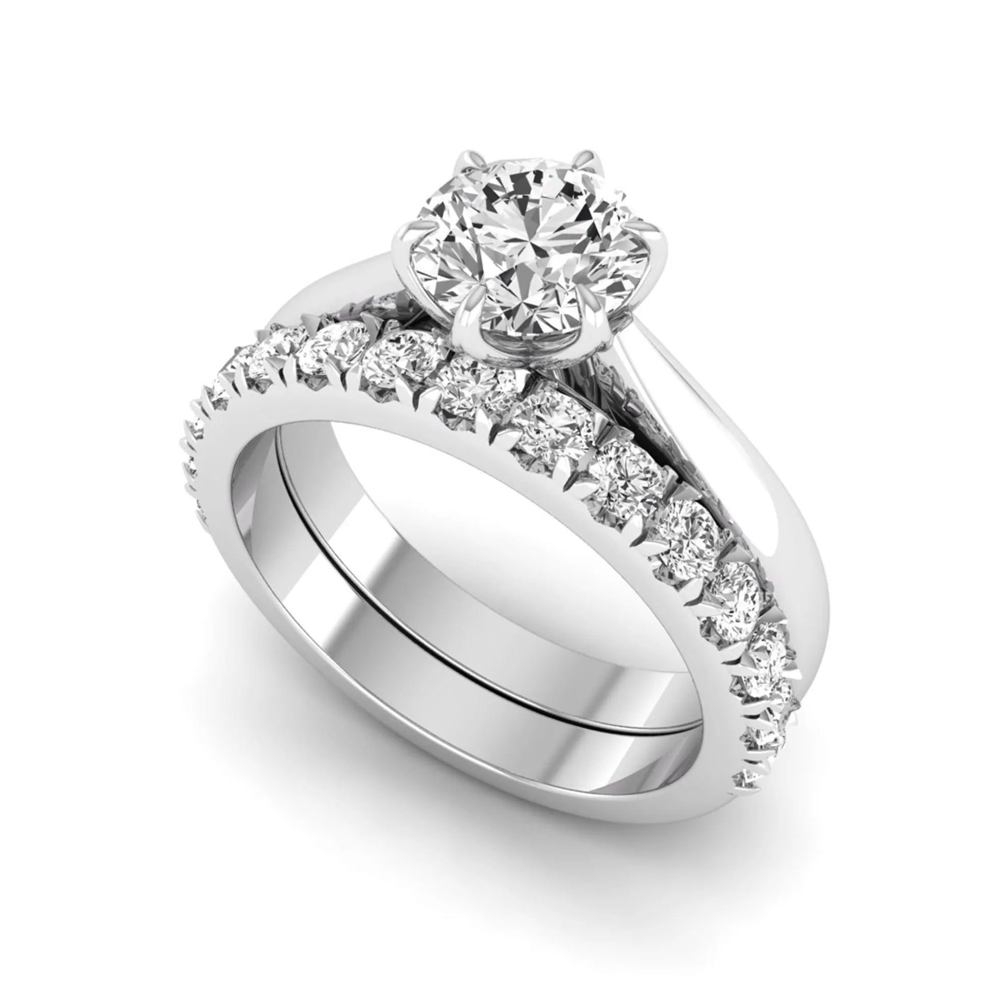 Round cut lab grown diamond solitaire bridal ring set featuring a six-prong engagement ring with a matching shared-prong round diamond wedding band in white gold tone design.