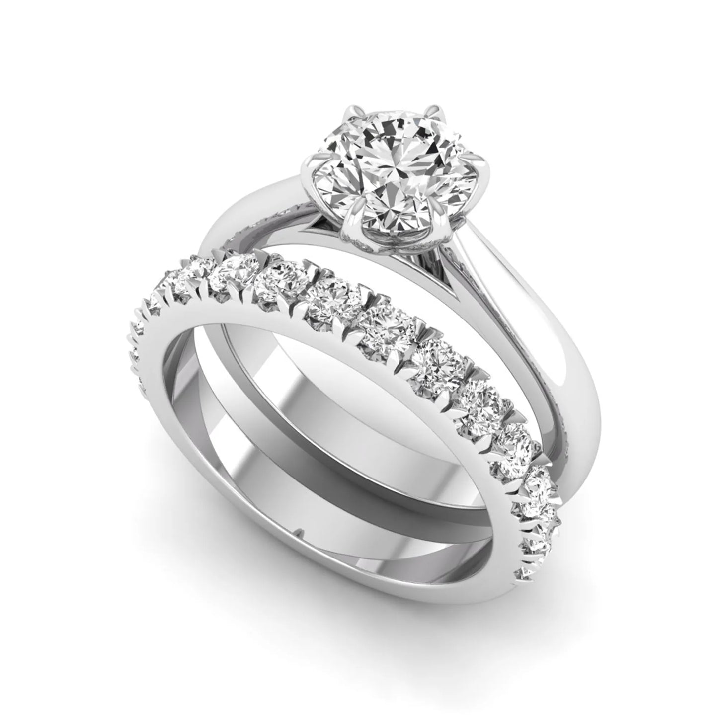 Round cut lab grown diamond solitaire bridal ring set featuring a six-prong engagement ring with a matching shared-prong round diamond wedding band in white gold tone design.