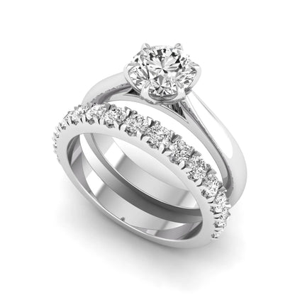 Round cut lab grown diamond solitaire bridal ring set featuring a six-prong engagement ring with a matching shared-prong round diamond wedding band in white gold tone design.