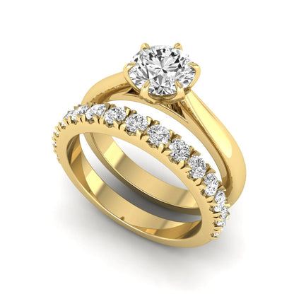 Round cut lab grown diamond solitaire bridal ring set featuring a six-prong engagement ring with a matching shared-prong round diamond wedding band in yellow gold tone design.