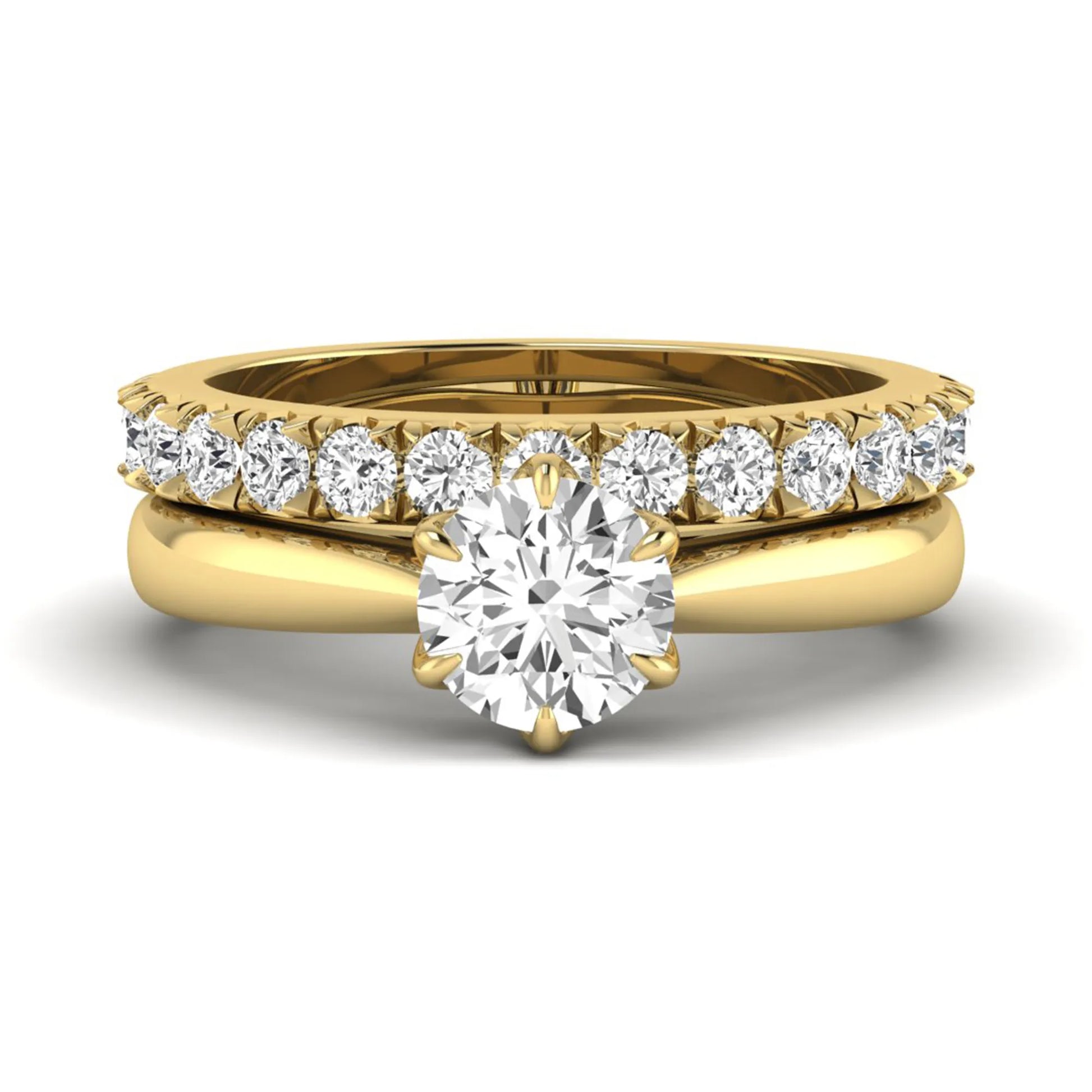 Round cut lab grown diamond solitaire bridal ring set featuring a six-prong engagement ring with a matching shared-prong round diamond wedding band in yellow gold tone design.