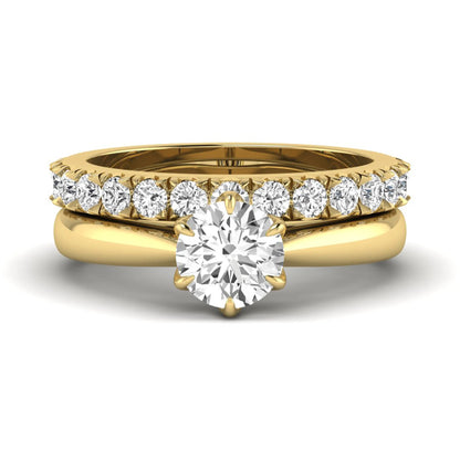 Round cut lab grown diamond solitaire bridal ring set featuring a six-prong engagement ring with a matching shared-prong round diamond wedding band in yellow gold tone design.