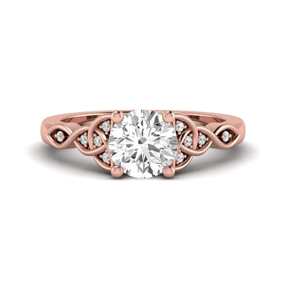 Round cut lab grown diamond solitaire engagement ring featuring a four-prong center diamond with an intricate Celtic knot-inspired band and round accent diamonds in a rose gold finish.
