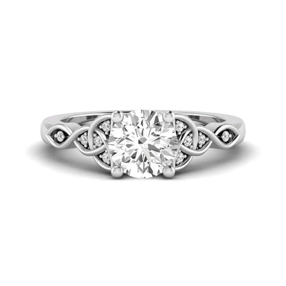 Round cut lab grown diamond solitaire engagement ring featuring a four-prong center diamond with an intricate Celtic knot-inspired band and round accent diamonds in a white gold finish.