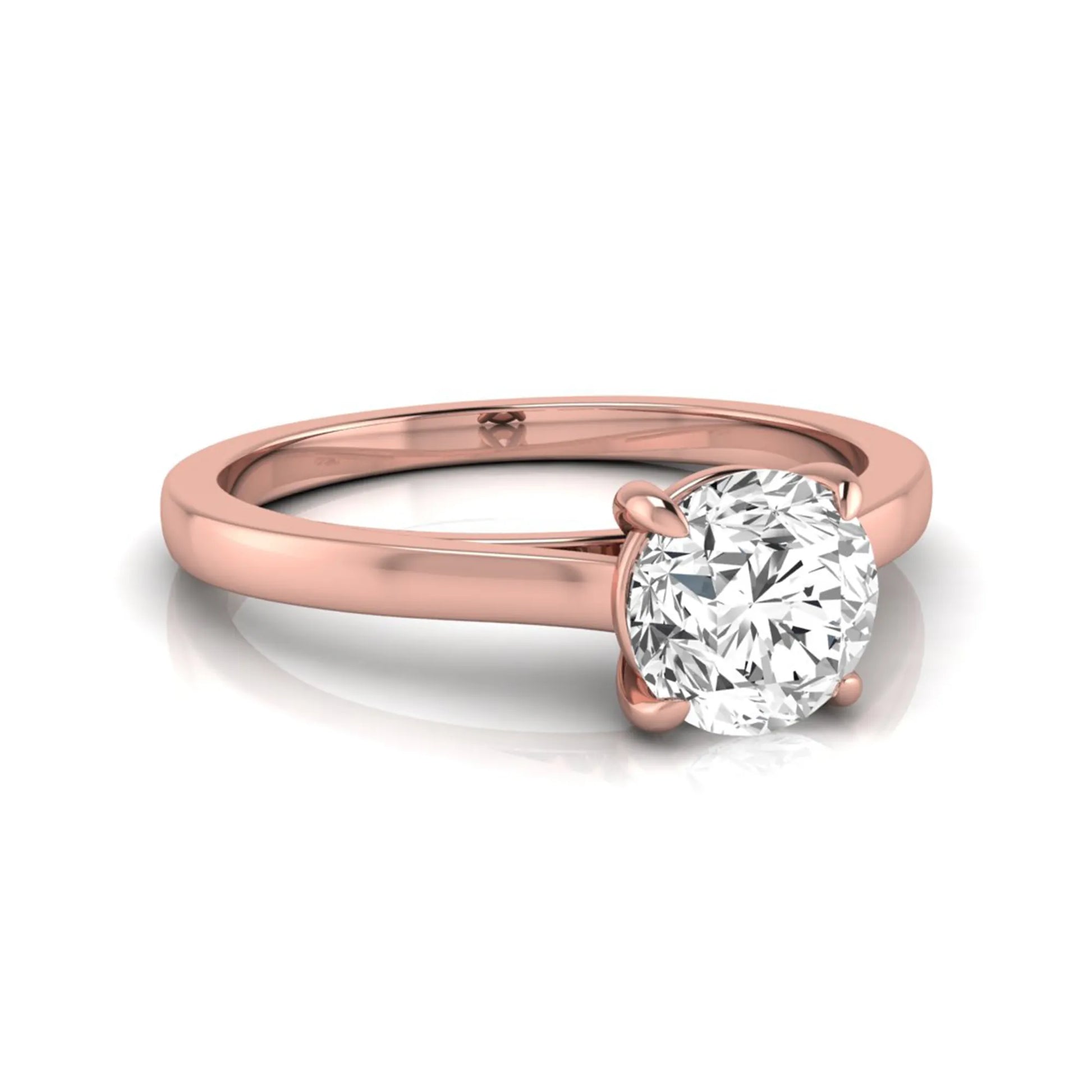 Round cut lab grown diamond solitaire engagement ring featuring an IGI certified center diamond in a classic four-prong setting with a slim polished band in rose gold