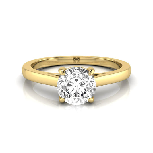Round cut lab grown diamond solitaire engagement ring featuring an IGI certified center diamond in a classic four-prong setting with a slim polished band in yellow gold